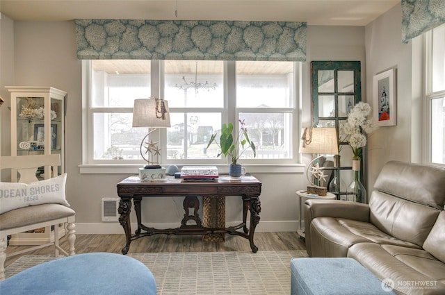 office featuring baseboards and wood finished floors