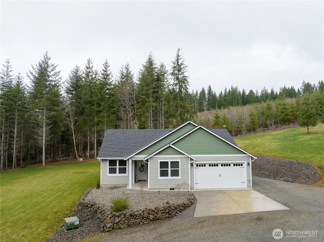 view of front of house with driveway, a garage, a front lawn, and roof with shingles