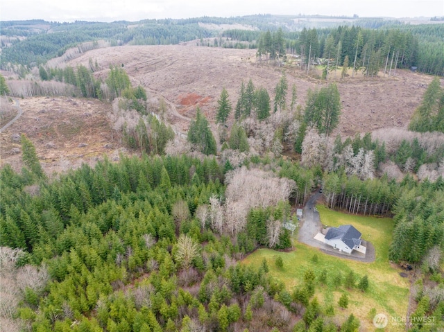 bird's eye view featuring a forest view