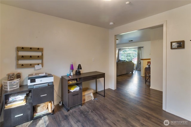 home office featuring dark wood-style floors and baseboards