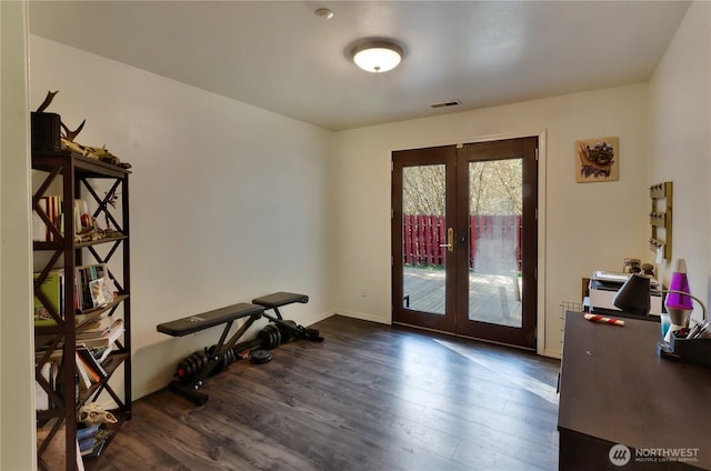 interior space with french doors, visible vents, dark wood finished floors, and baseboards