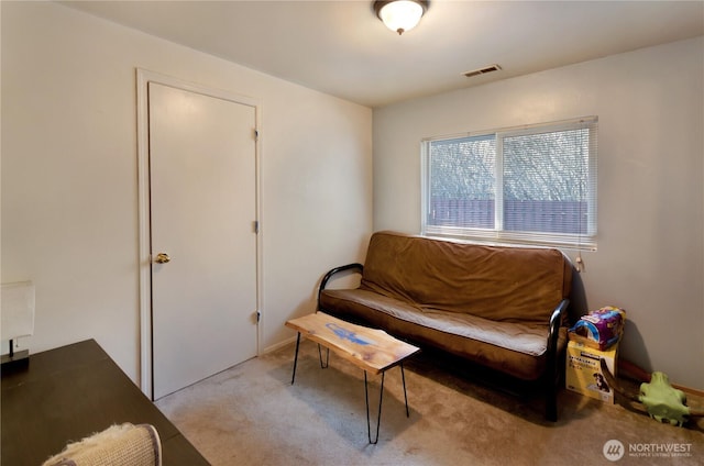 sitting room with carpet floors and visible vents