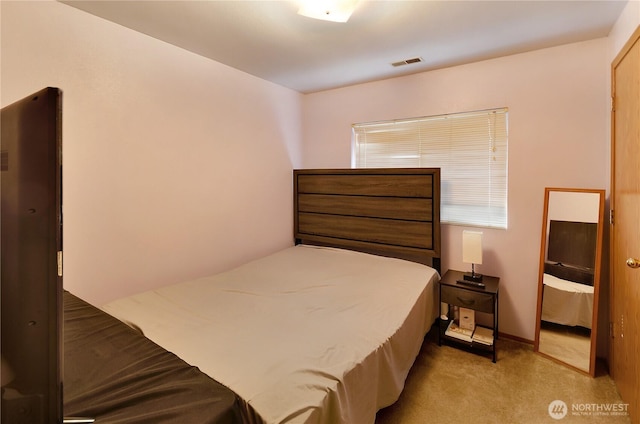 bedroom featuring visible vents and carpet flooring