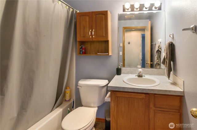 bathroom with shower / bath combination with curtain, vanity, and toilet