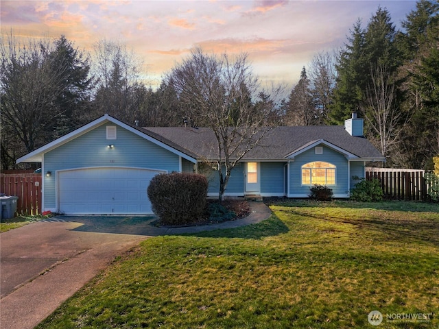 single story home featuring an attached garage, a lawn, fence, and concrete driveway