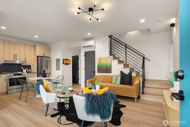 living area with light wood-style flooring, electric panel, stairway, and an AC wall unit