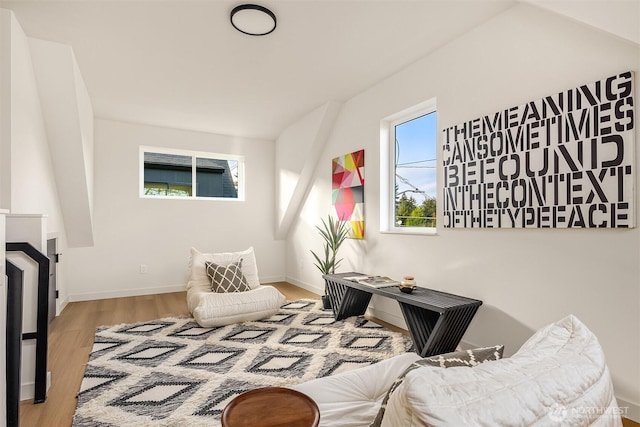 living area featuring wood finished floors and baseboards