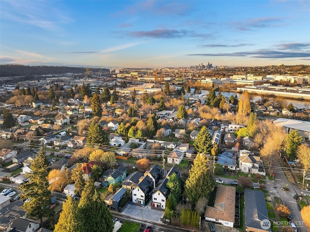 birds eye view of property with a residential view and a water view