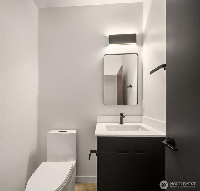 bathroom with vanity and toilet