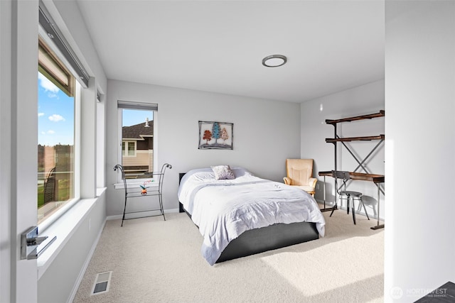 bedroom featuring carpet flooring, visible vents, and baseboards