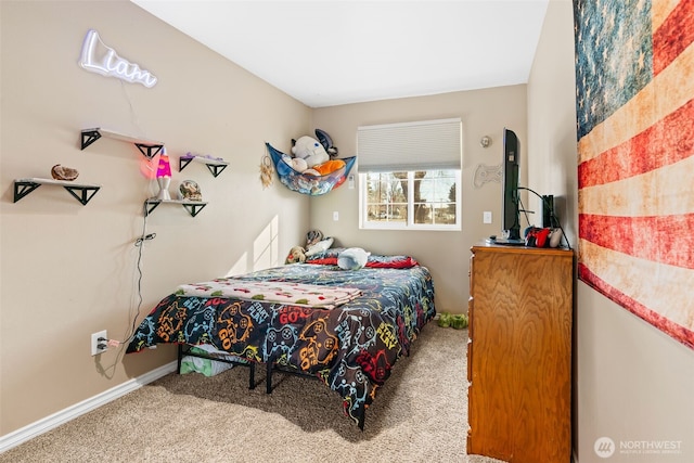 bedroom featuring carpet floors and baseboards