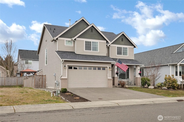 craftsman-style home with an attached garage, fence, concrete driveway, and brick siding