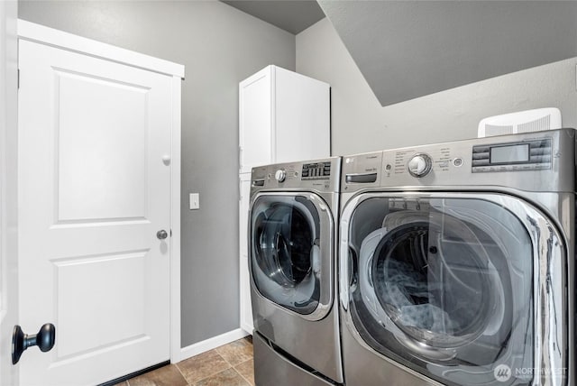 washroom featuring independent washer and dryer and baseboards