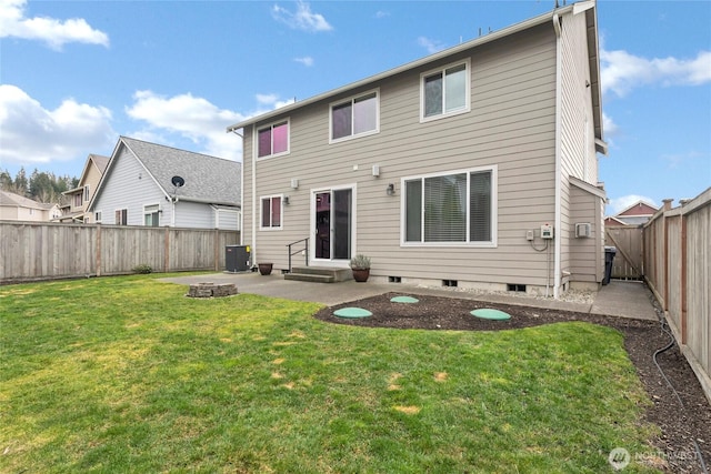 rear view of house with entry steps, a lawn, a fenced backyard, central air condition unit, and a patio area