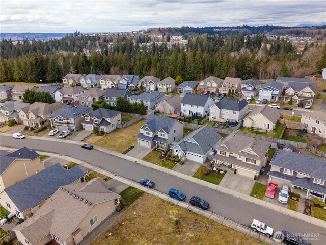 birds eye view of property with a residential view