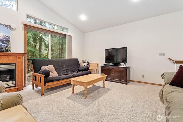 living room featuring a fireplace, lofted ceiling, recessed lighting, light colored carpet, and baseboards