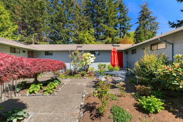 ranch-style house featuring a patio area