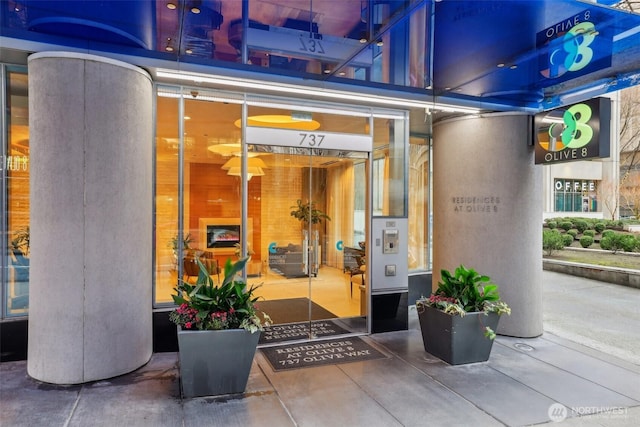 entrance to property featuring stucco siding