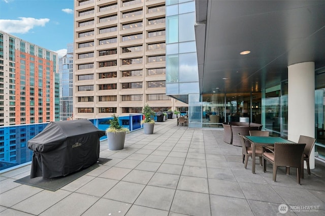 view of patio / terrace with a view of city and area for grilling