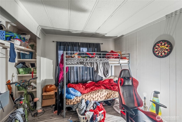 bedroom with wood finished floors