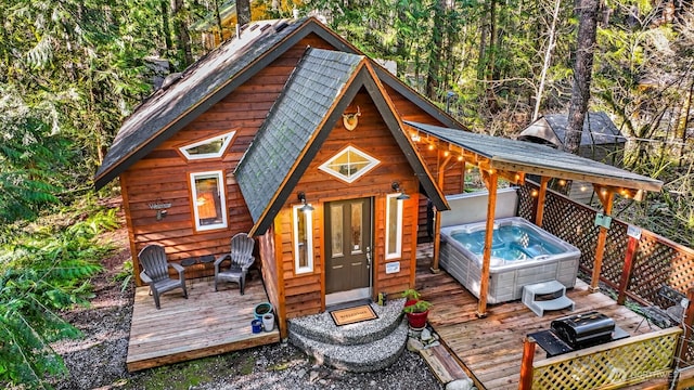 view of outbuilding featuring a hot tub