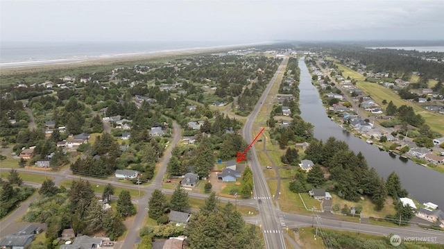 birds eye view of property featuring a water view