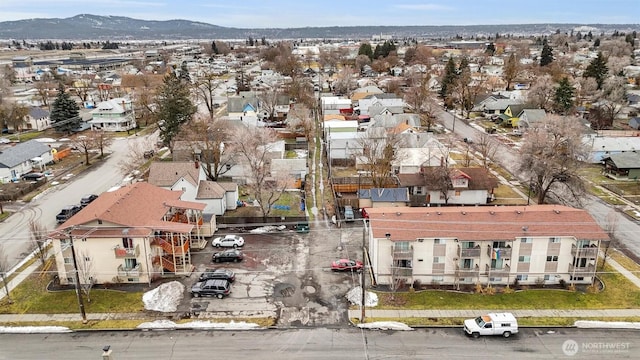 drone / aerial view featuring a residential view and a mountain view