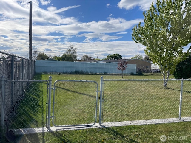 view of yard with a gate and fence