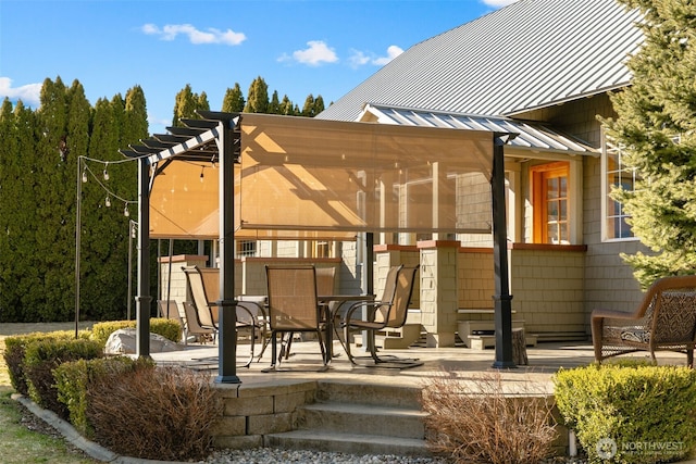 exterior space featuring a patio area, a pergola, a standing seam roof, and metal roof