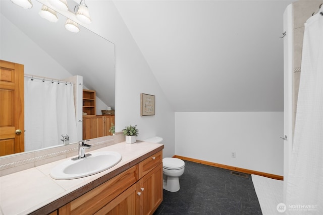 full bathroom with visible vents, toilet, lofted ceiling, baseboards, and vanity