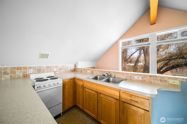 kitchen with electric stove, a sink, backsplash, light countertops, and vaulted ceiling