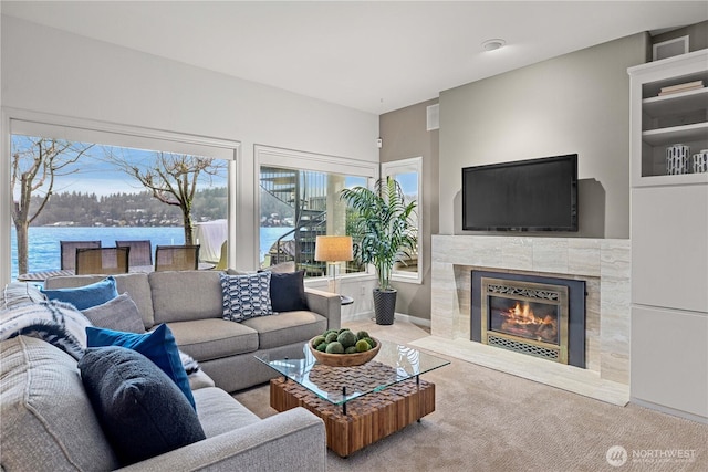 carpeted living room with a fireplace