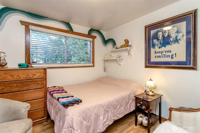 bedroom with wood finished floors