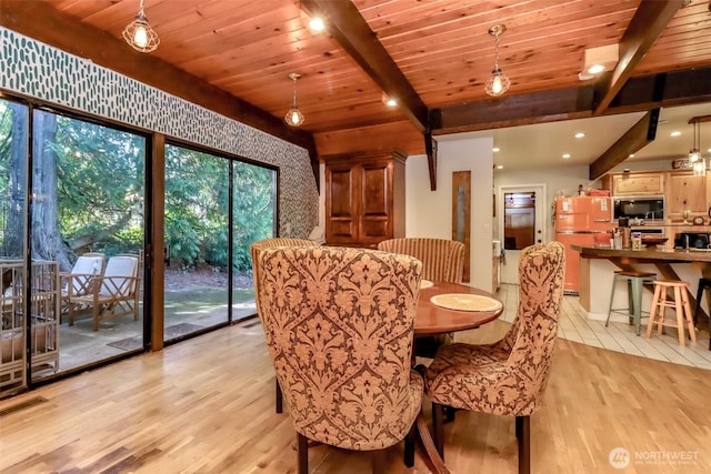 dining room featuring wood ceiling, light wood finished floors, beamed ceiling, and visible vents