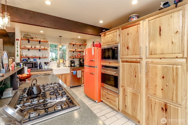 kitchen featuring open shelves, stainless steel appliances, light brown cabinetry, a sink, and beamed ceiling