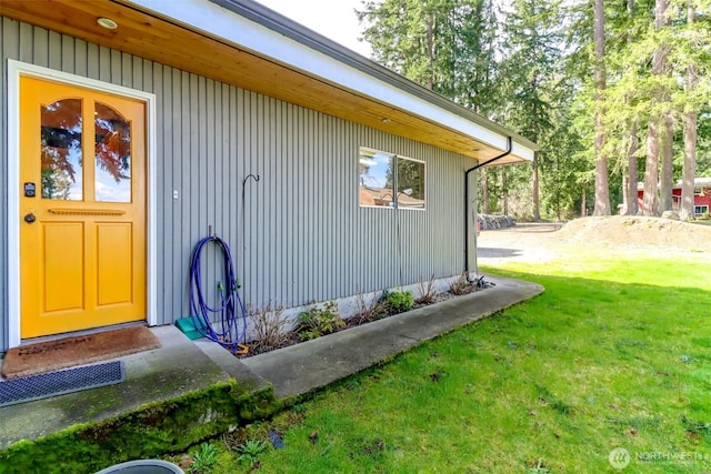 view of home's exterior with a lawn