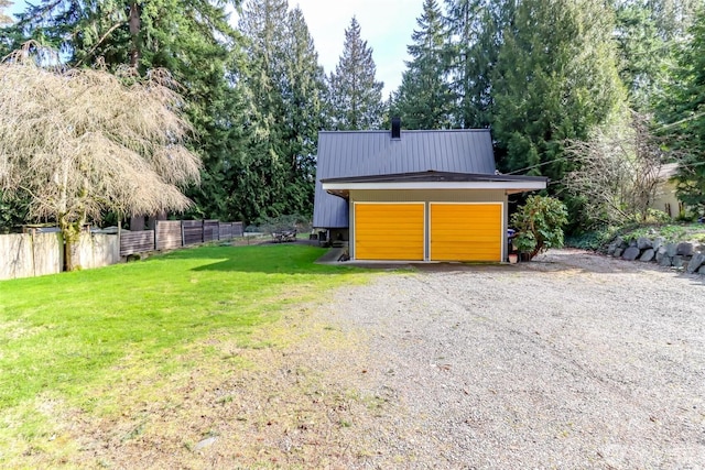 exterior space featuring an outbuilding and fence