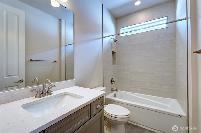 bathroom featuring toilet, washtub / shower combination, and vanity