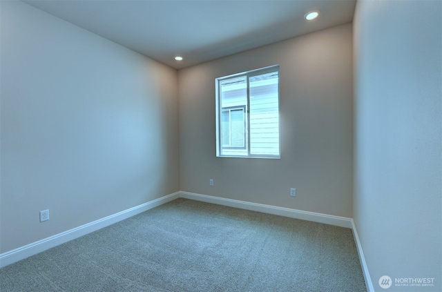 carpeted empty room featuring recessed lighting and baseboards