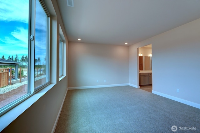 unfurnished room with light carpet, baseboards, visible vents, and recessed lighting