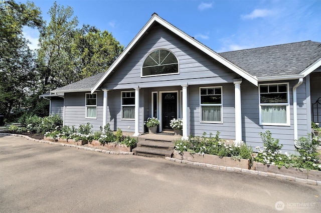 view of front of home featuring a shingled roof