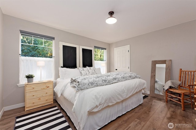 471 SE Old Arcadia Rd, Shelton, WA 98584 - bedroom with multiple windows, wood finished floors, and baseboards