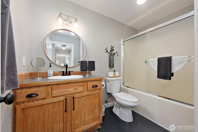 471 SE Old Arcadia Rd, Shelton, WA 98584 - full bathroom featuring toilet, vanity, bath / shower combo with glass door, and tile patterned floors