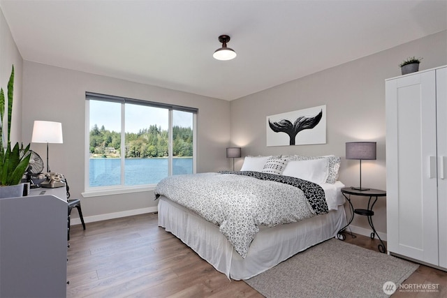 471 SE Old Arcadia Rd, Shelton, WA 98584 - bedroom with wood finished floors and baseboards