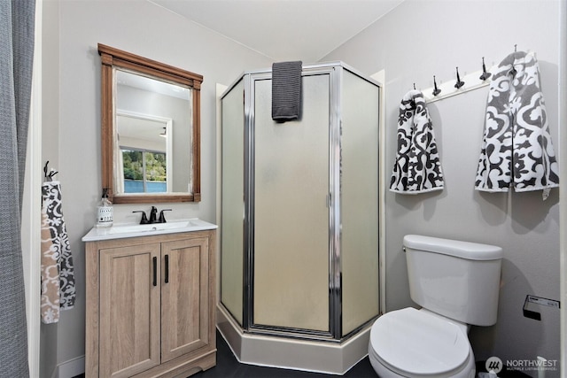 471 SE Old Arcadia Rd, Shelton, WA 98584 - bathroom featuring a stall shower, toilet, and vanity