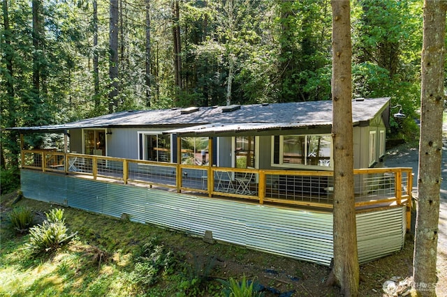 471 SE Old Arcadia Rd, Shelton, WA 98584 - back of property with a wooden deck and a wooded view