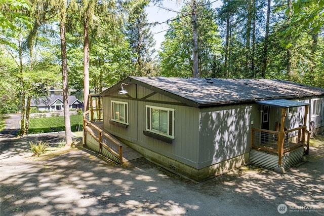 471 SE Old Arcadia Rd, Shelton, WA 98584 - view of property exterior featuring roof with shingles