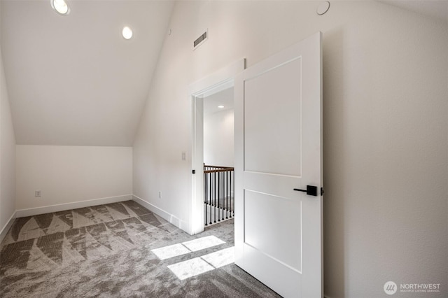 additional living space with carpet floors, baseboards, vaulted ceiling, and recessed lighting