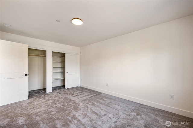 unfurnished bedroom featuring baseboards and carpet flooring