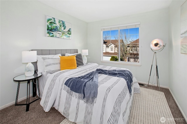 carpeted bedroom with baseboards